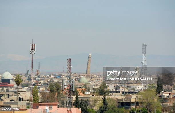 Picture shows the Mosul skyline featuring the historic leaning Al-Hadba minaret near the Great Mosque of Al-Nuri in Mosul, where Islamic State group...