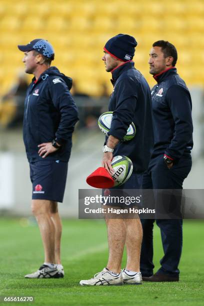 To R, Assistant coaches Chris Malone, Nathan Grey and coach Daryl Gibson of the Waratahs look on during the round seven Super Rugby match between the...