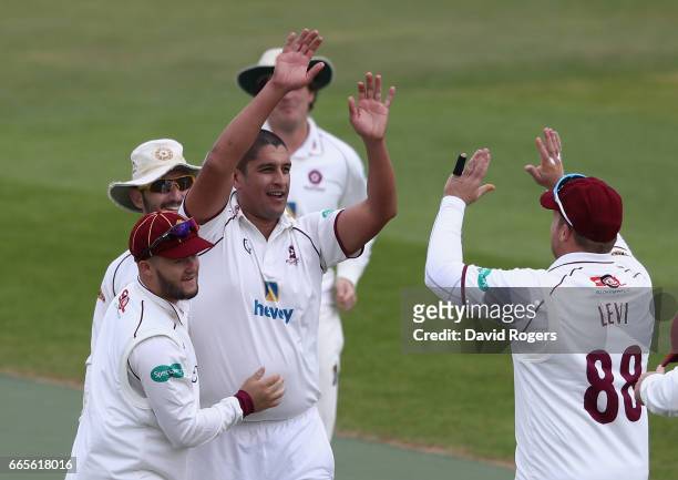 Rory Kleinveldt of Northamptonshire celebrates with team mates after taking the wicket of David Lloyd, LBW for a duck during the Specsavers County...