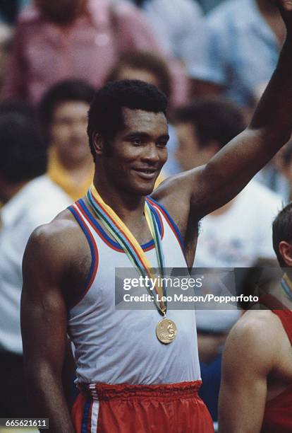 Cuban gold medal winning boxer Teofilo Stevenson stands on the medal podium after beating Pyotr Zayev of the Soviet Union in the final of the...