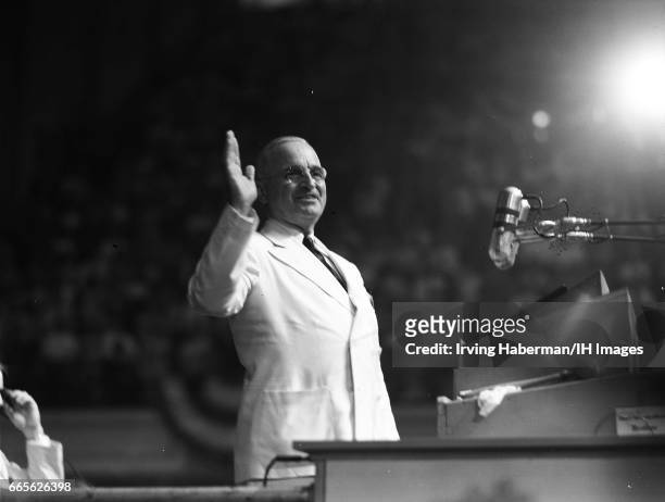 View of American politician United States President Harry S. Truman as he waves from the dais during the Democratic National Convention on July 14,...
