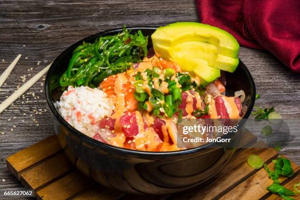 raw fish sushi pokebowl meal with red napkin - pokes stock pictures, royalty-free photos & images