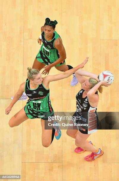 Caitlin Thwaites of the Magpies shoots as Courtney Bruce of the Fever defends during the round eight Super Netball match between the Magpies and...
