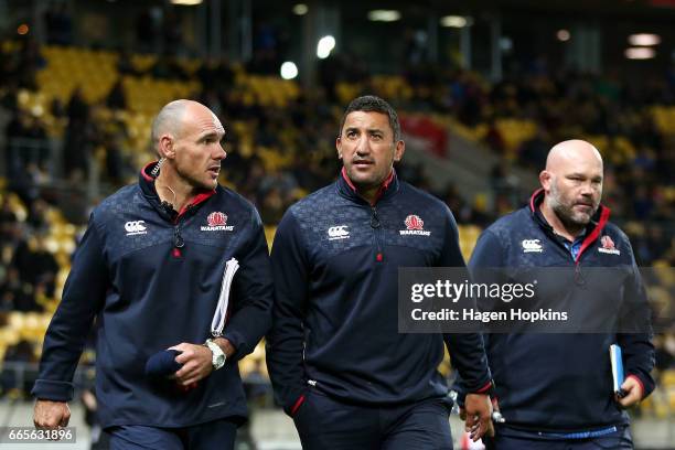 Assistant Coach Nathan Grey, Coach Daryl Gibson and Assistant Coach Cam Blades of the Waratahs look on during the round seven Super Rugby match...