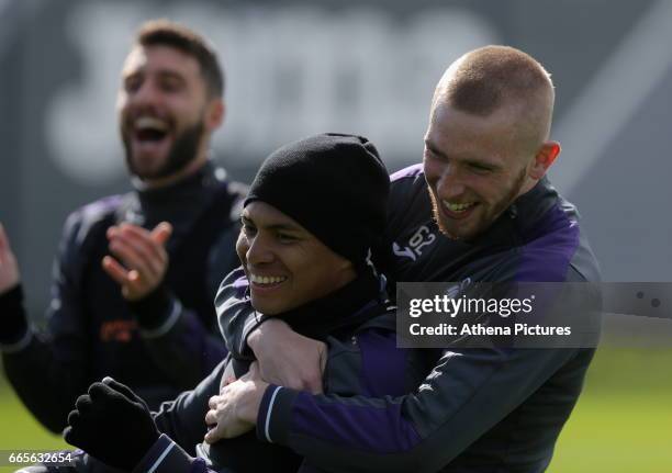 Jefferson Montero and Oliver McBurnie play fight during the Swansea City Training at The Fairwood Training Ground on April 4, 2017 in Swansea, Wales.