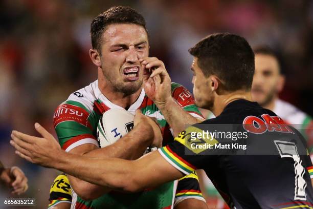 Sam Burgess of the Rabbitohs is tackled during the round six NRL match between the Penrith Panthers and the South Sydney Rabbitohs at Pepper Stadium...