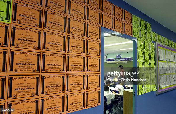Student certificates of merit hang outside teacher Robin Cash's classroom at "Knowledge is Power Program" Academy October 4, 2000 in The Bronx, New...