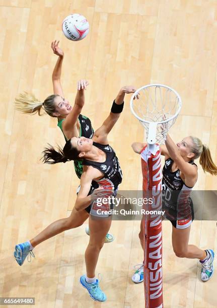 Sharni Layton of the Magpies attempts to block a shot by Kaylia Stanton of the Fever during the round eight Super Netball match between the Magpies...