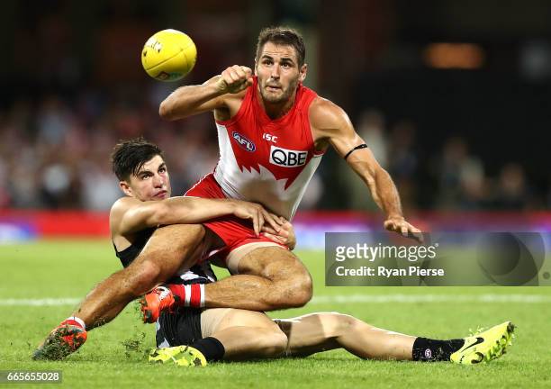 Josh Kennedy of the Swans is tackled by Brayden Maynard of the Magpies during the round three AFL match between the Sydney Swans and the Collingwood...