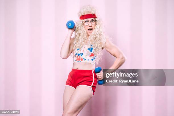 aerobics teacher working out - insólito imagens e fotografias de stock