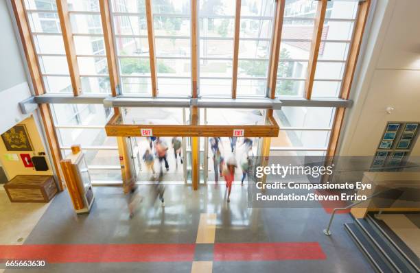 students in busy hallway - school building entrance stock pictures, royalty-free photos & images