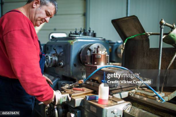 engineer working at lathe - workbench stock pictures, royalty-free photos & images