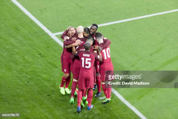 Michael Bradley of the United States is congratulated by teammates following his goal scored duirng the FIFA 2018 World Cup Qualifier match between...