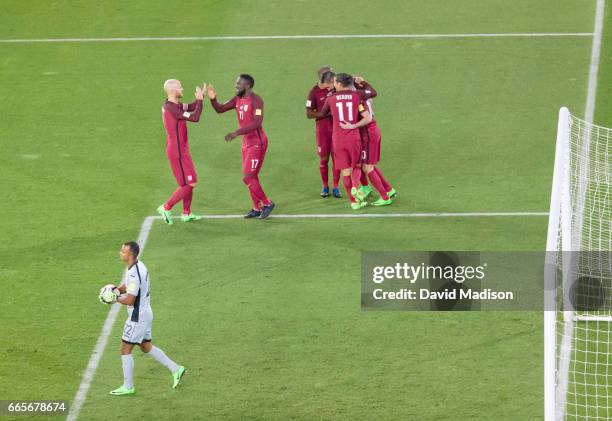 Christian Pulisic of the United States is congratulated by teammates following his goal in the FIFA 2018 World Cup Qualifier match between the United...