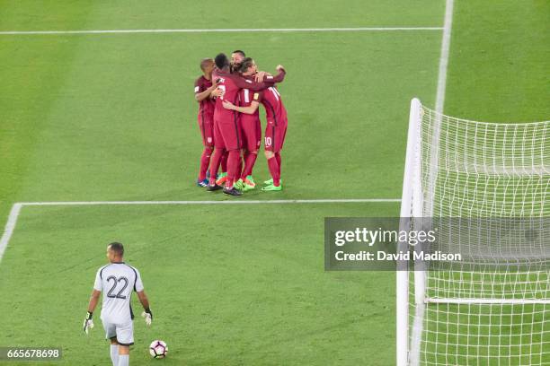 Christian Pulisic of the United States is congratulated by teammates following his goal in the FIFA 2018 World Cup Qualifier match between the United...