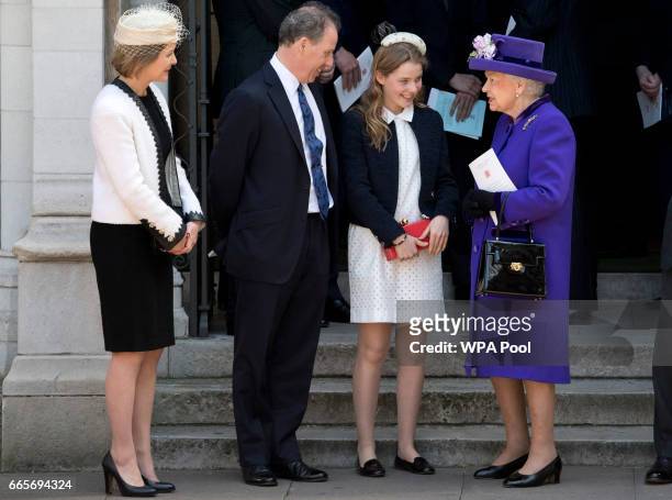 Britain's Queen Elizabeth II speaks to Serena Armstrong-Jones, David Armstrong-Jones and Margarita Armstrong-Jones as they leave a Service of...