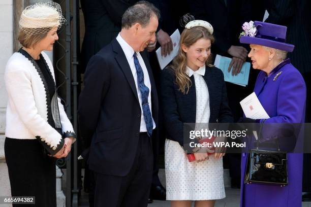 Britain's Queen Elizabeth II speaks to Serena Armstrong-Jones, David Armstrong-Jones and Margarita Armstrong-Jones as they leave a Service of...