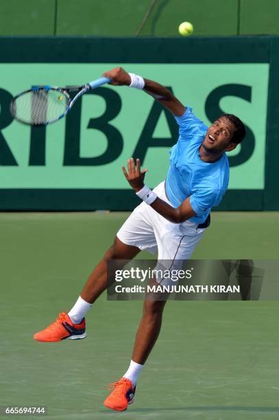 Indian player Ramkumar Ramanathan plays a shot during a singles match against Uzbekistan's Temur Ismailov at the Davis Cup Asia Oceania group one tie...