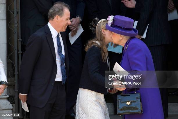 Queen Elizabeth II kisses Lady Margarita Armstrong-Jones as her father David Armstrong-Jones looks on as they leave a Service of Thanksgiving for the...