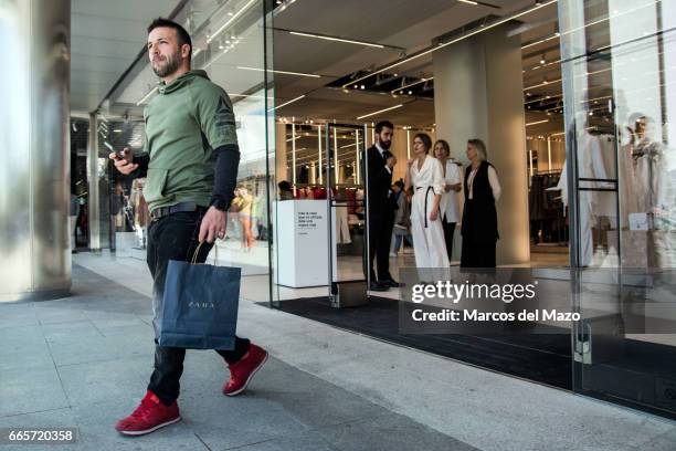 Man walks out of the world's biggest Zara during the opening day. The store has 6,000 square meters.
