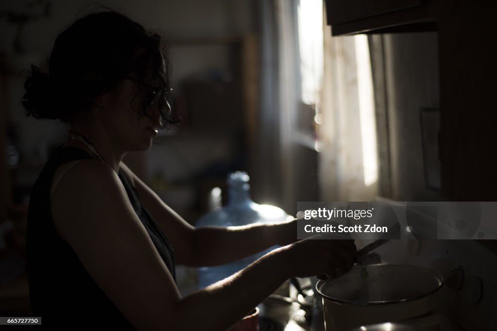 Woman cooking at stove