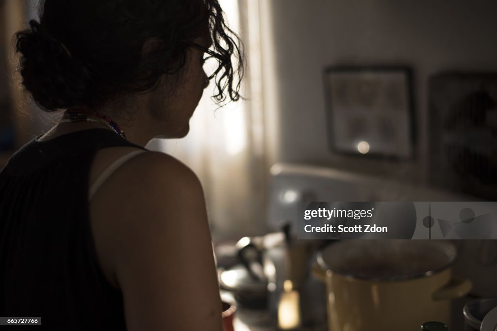 Woman cooking at stove