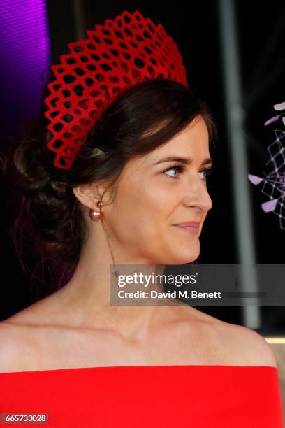 An elegant racegoer poses on stage at the Best Dressed award at Ladies Day at The 2017 Randox Health Grand National Festival at Aintree Racecourse on...