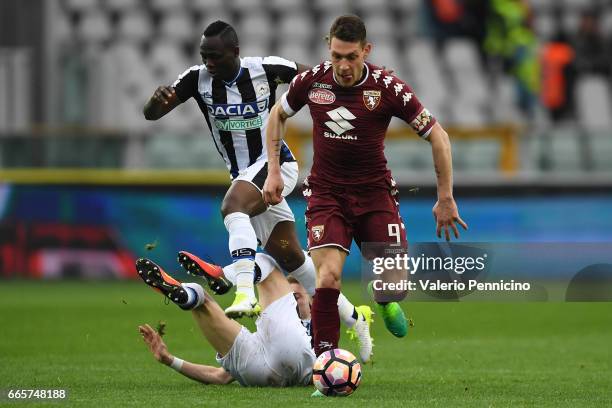 Andrea Belotti of FC Torino in action against Emmanuel Badu and Jakub Jankto of Udinese Calcio during the Serie A match between FC Torino and Udinese...