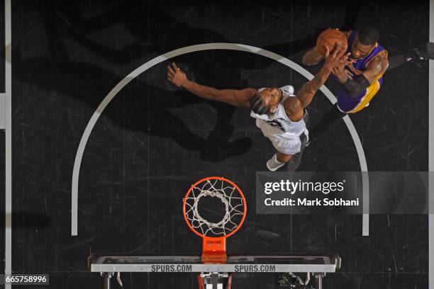Thomas Robinson of the Los Angeles Lakers drives to the basket and get his shot blocked by Kawhi Leonard of the San Antonio Spurs on April 5, 2017 at...