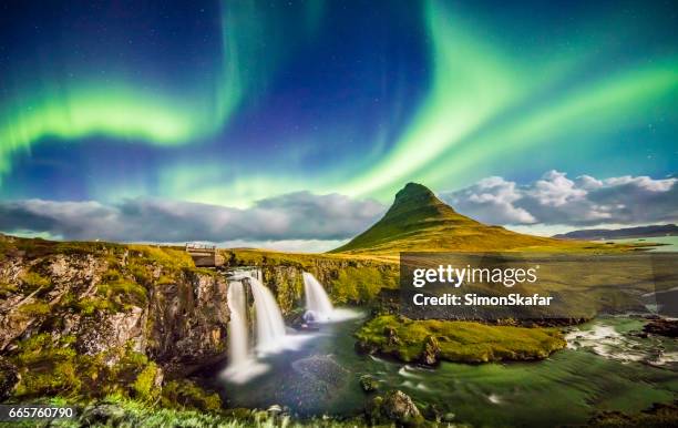 aurora over kirkjufell and waterfall at night - majestic waterfall stock pictures, royalty-free photos & images