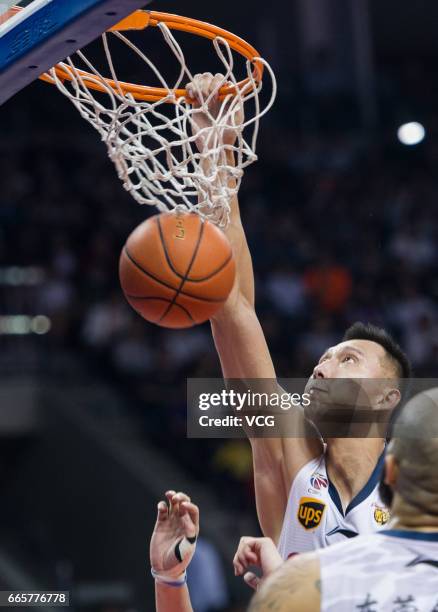 Yi Jianlian of Guangdong Southern Tigers dunks against Xinjiang Flying Tigers in Game Four of the 2017 CBA Finals at Dongguan Basketball Center on...