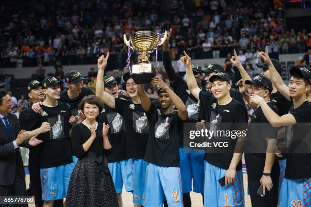 Players of Xinjiang Flying Tigers celebrate after defeating Guangdong Southern Tigers in Game Four of the 2017 CBA Finals at Dongguan Basketball...