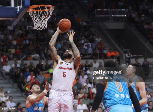 Carlos Boozer of Guangdong Southern Tigers shoots the ball against Xinjiang Flying Tigers in Game Four of the 2017 CBA Finals at Dongguan Basketball...