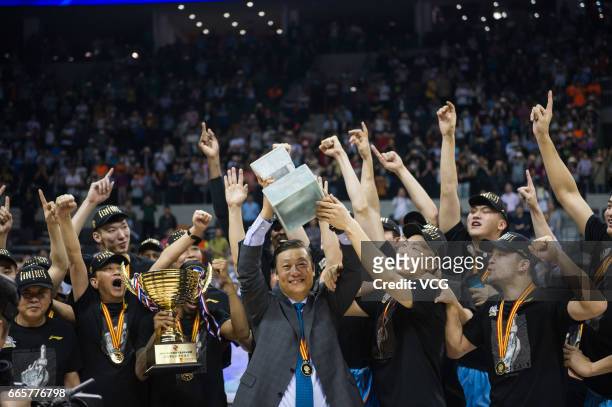 Players of Xinjiang Flying Tigers celebrate after defeating Guangdong Southern Tigers in Game Four of the 2017 CBA Finals at Dongguan Basketball...