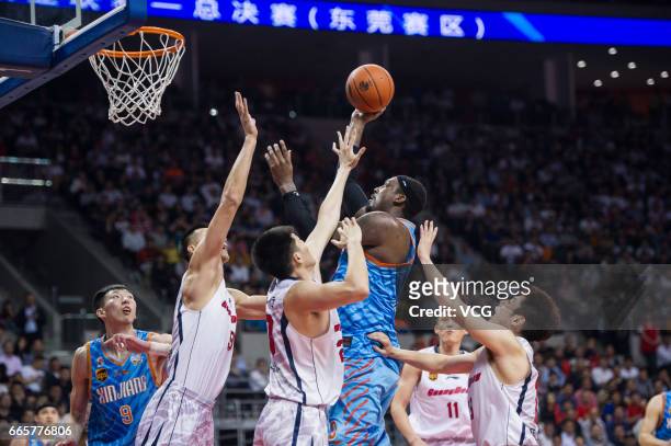 Andray Blatche of Xinjiang Flying Tigers shoots the ball against Guangdong Southern Tigers in Game Four of the 2017 CBA Finals at Dongguan Basketball...