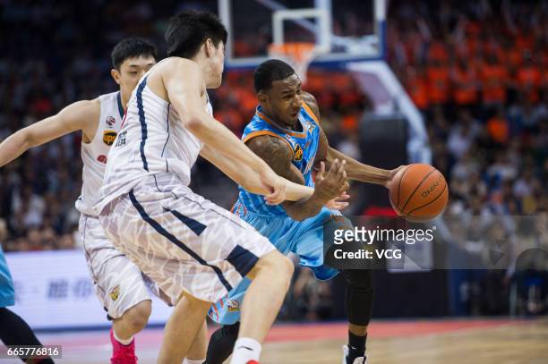 Darius Adams of Xinjiang Flying Tigers drives the ball against Guangdong Southern Tigers in Game Four of the 2017 CBA Finals at Dongguan Basketball...