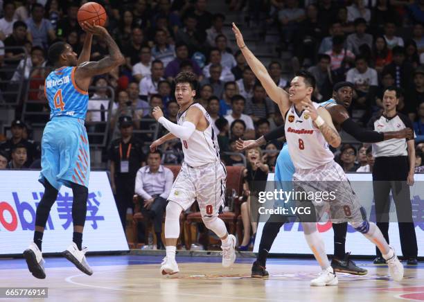 Darius Adams of Xinjiang Flying Tigers shoots the ball against Guangdong Southern Tigers in Game Four of the 2017 CBA Finals at Dongguan Basketball...