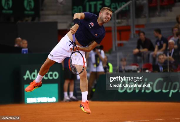 Daniel Evans of Great Britain serves during the singles match against Jeremy Chardy of France on day one of the Davis Cup World Group Quarter-Final...