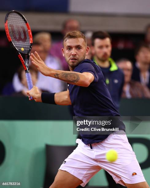 Daniel Evans of Great Britain hits a forehand during the singles match against Jeremy Chardy of France on day one of the Davis Cup World Group...