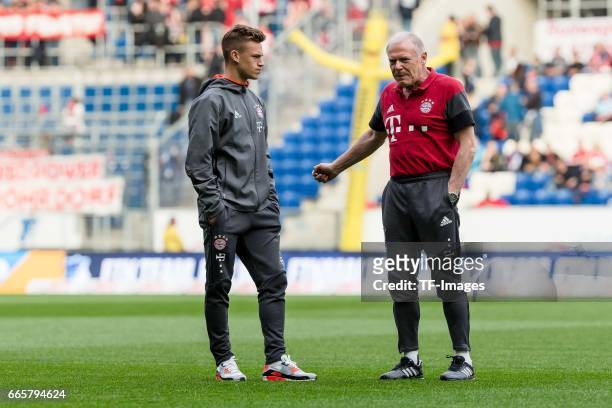 Joshua Kimmich of Munich Co- coach Hermann Gerland of Munich looks on before the Bundesliga match between TSG 1899 Hoffenheim and Bayern Muenchen at...