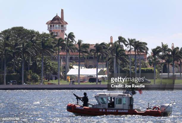 Coast Guard boat is seen patrolling in front of the Mar-a-Lago Resort where President Donald Trump held meetings with Chinese President Xi Jinping on...