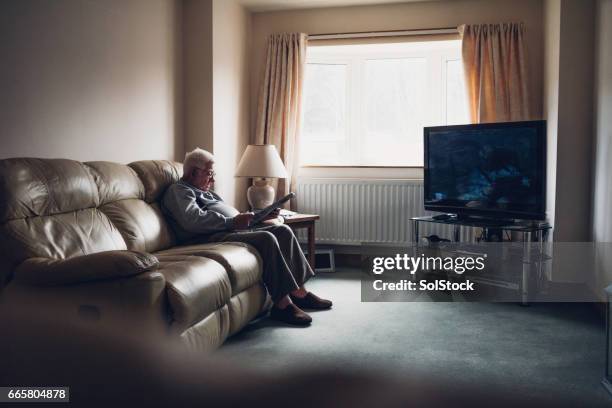 senior man home alone - senior loneliness stock pictures, royalty-free photos & images