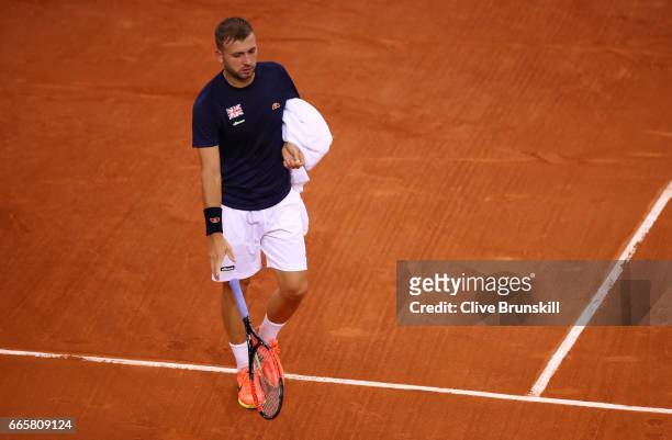 Daniel Evans of Great Britain throws his racquet during the singles match against Jeremy Chardy of France on day one of the Davis Cup World Group...