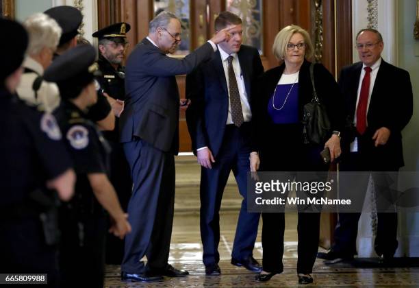 Senate Minority Leader Chuck Schumer confers with Sen. Claire McCaskill after leaving the floor of the Senate following the confirmation of Judge...