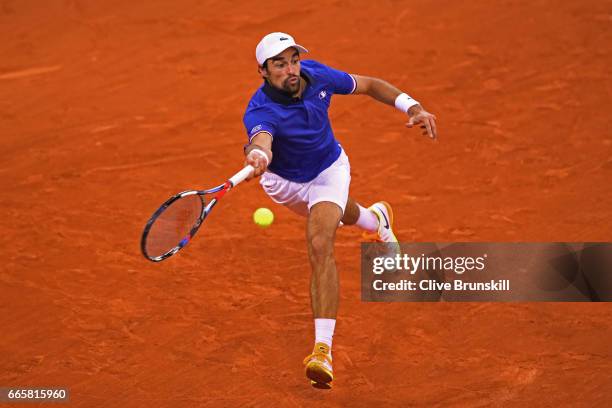 Jeremy Chardy of France stretches to hit a forehand during the singles match against Daniel Evans of Great Britain on day one of the Davis Cup World...