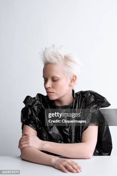 conceptual portrait of blond-haired woman - crazy white hair stock pictures, royalty-free photos & images