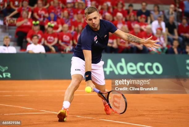 Daniel Evans of Great Britain volleys during the singles match against Jeremy Chardy of France on day one of the Davis Cup World Group Quarter-Final...