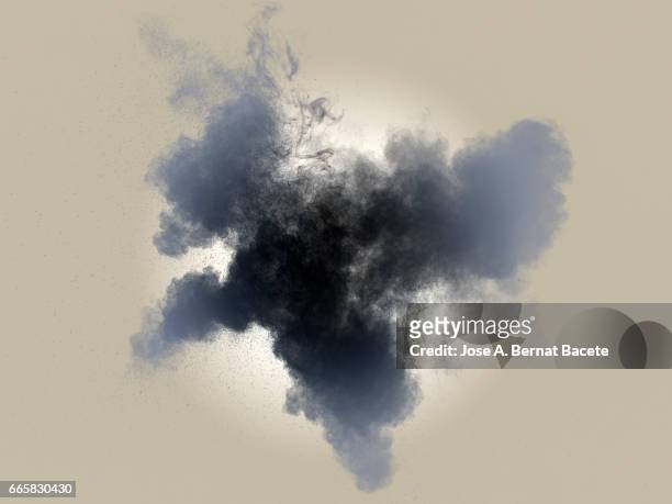 explosion of a cloud of powder of particles of  colors gray and black on a brown background - etéreo stockfoto's en -beelden