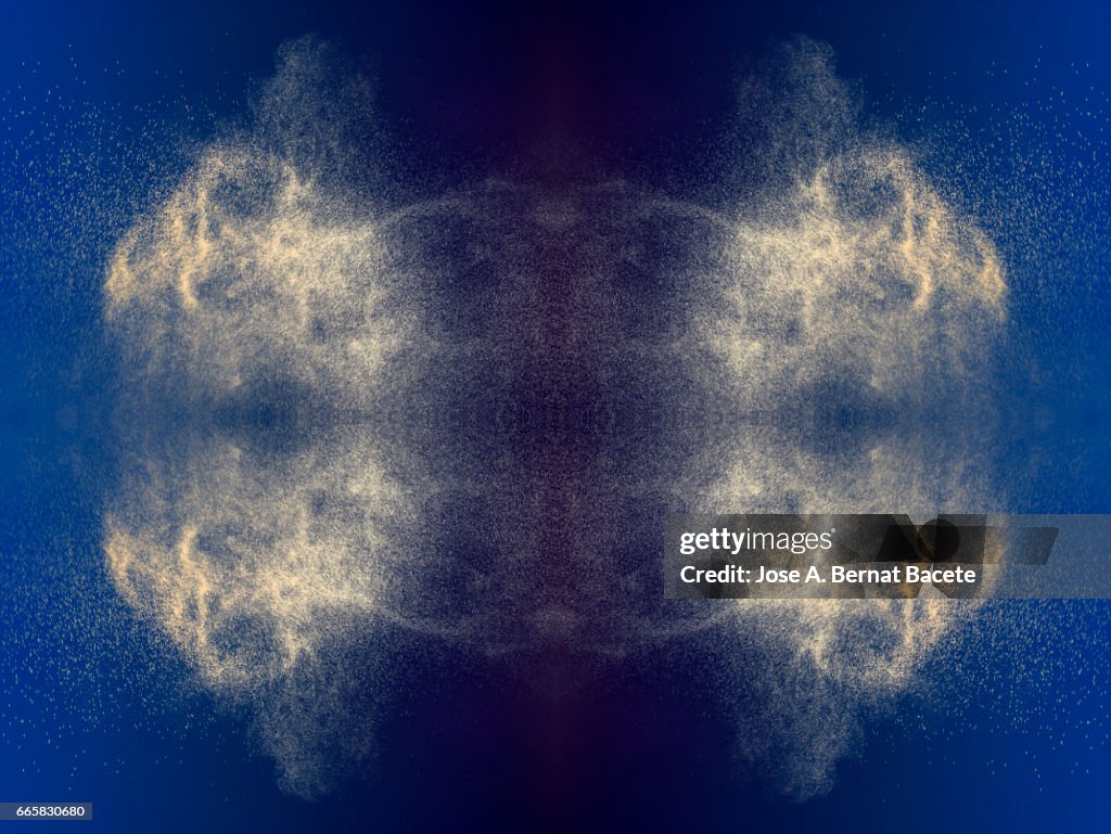 Explosion of water drops of  colors gray and brown, floating in the air  on a blue background