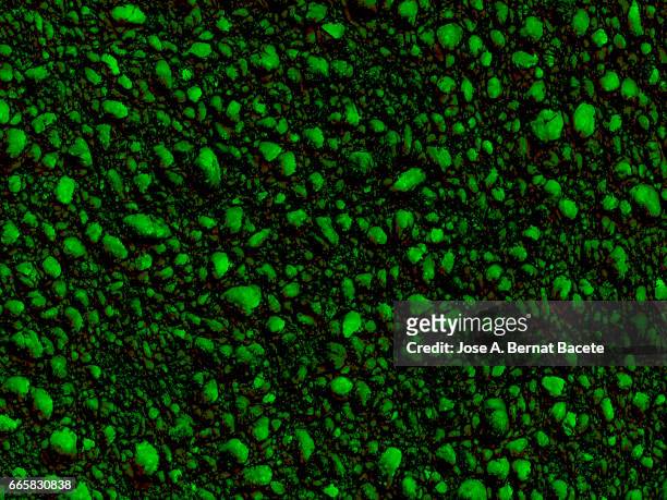 full frame of coarse and wavy textures of colored foam, green background - tejido stock-fotos und bilder